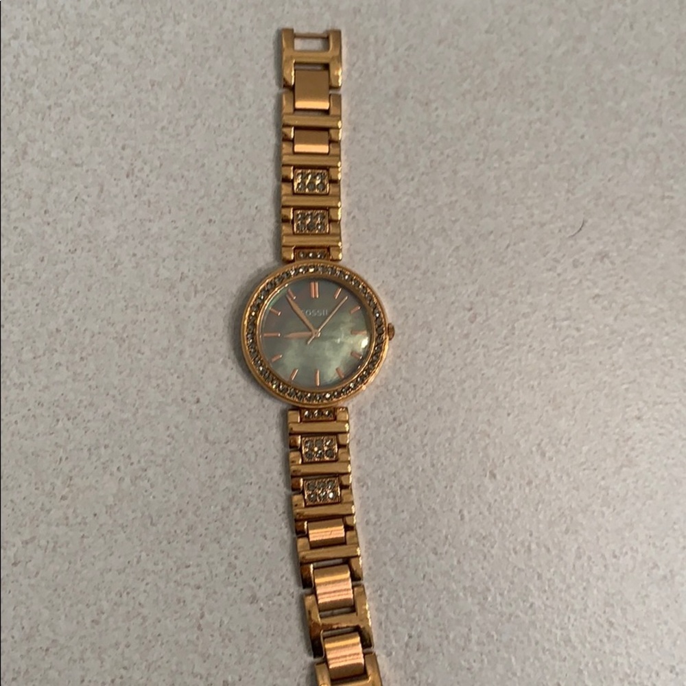 Rose Gold Fossil watch, with grey pearlized face.